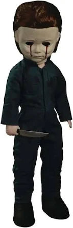 Plush doll with dark clothing and a knife, resembling a character from a horror movie.