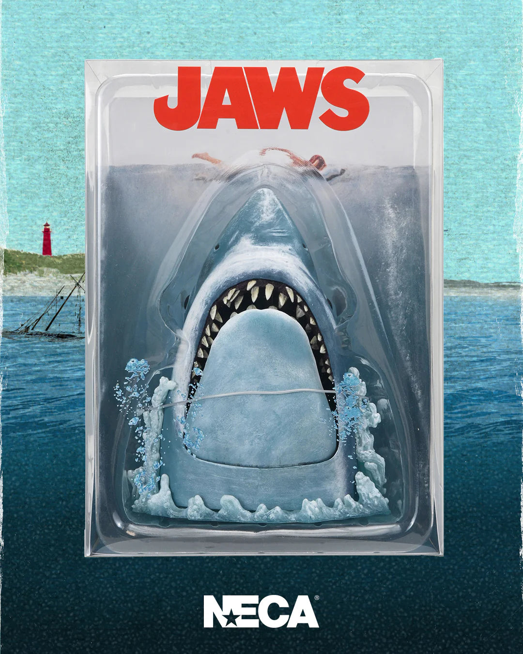 NECA Jaws toy figure packaging with shark and swimmers on a blue background